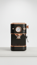 Compact minimalist espresso machine with copper accents